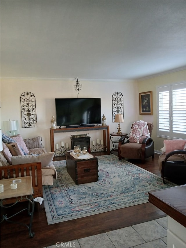 living room featuring crown molding and light tile patterned floors