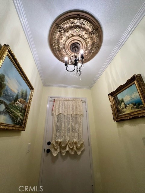 room details featuring a notable chandelier and crown molding