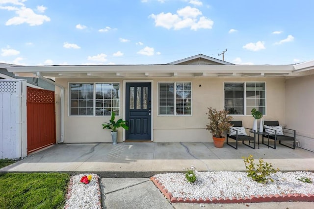 entrance to property featuring a patio