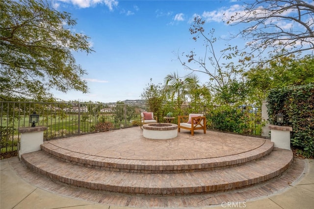 view of patio / terrace with a fire pit