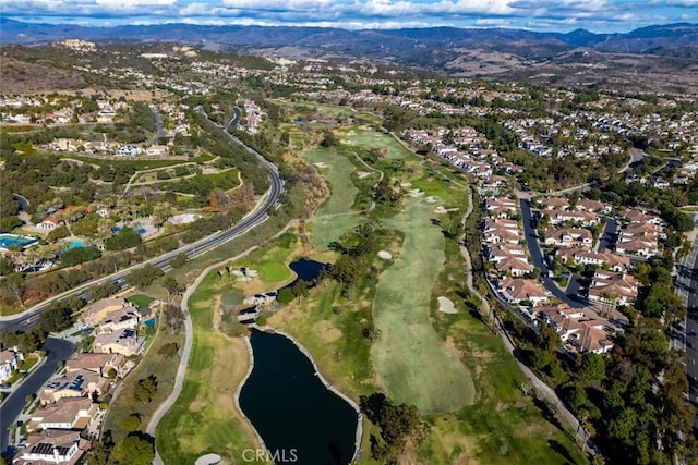 aerial view featuring a water and mountain view