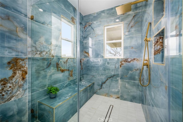 bathroom with tiled shower