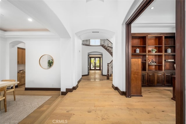 hallway with light hardwood / wood-style flooring