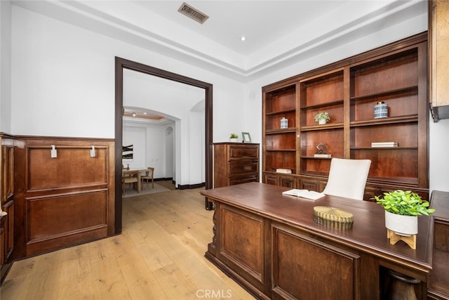 office space with light hardwood / wood-style floors