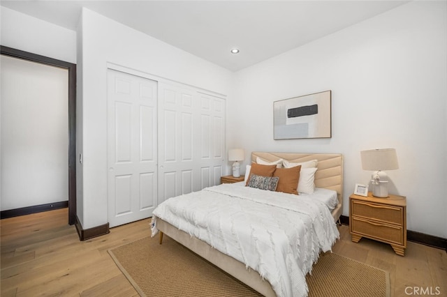 bedroom with a closet and light wood-type flooring