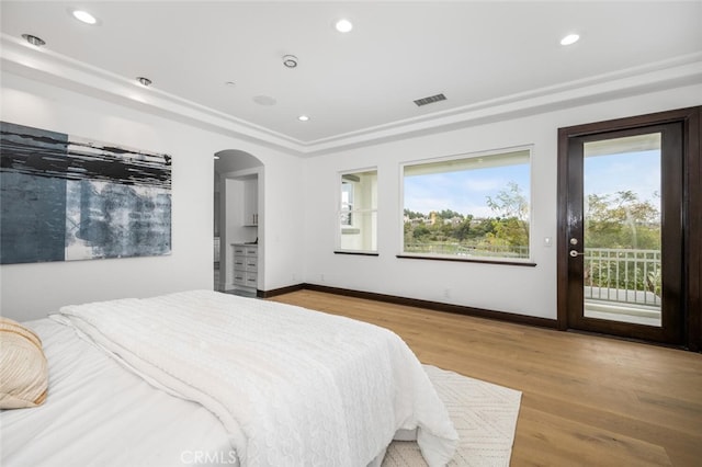 bedroom with access to outside and light hardwood / wood-style floors