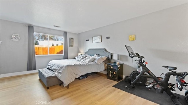 bedroom with light hardwood / wood-style floors