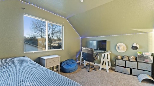 carpeted bedroom featuring lofted ceiling