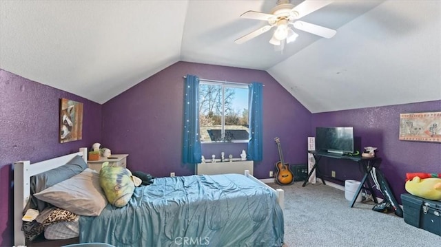 carpeted bedroom featuring lofted ceiling and ceiling fan