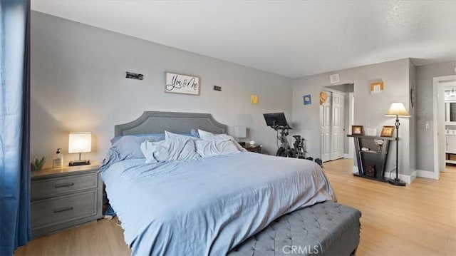 bedroom with light hardwood / wood-style floors