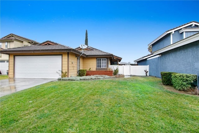 view of front of property featuring a garage and a front yard