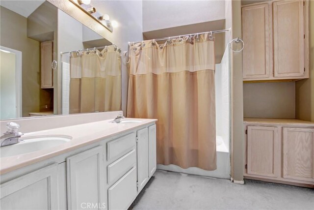 bathroom with vanity and shower / bath combo with shower curtain