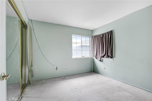 empty room with light colored carpet