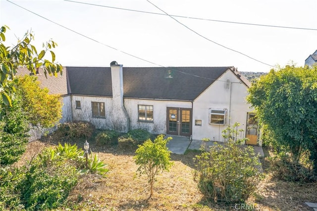 rear view of house with a patio