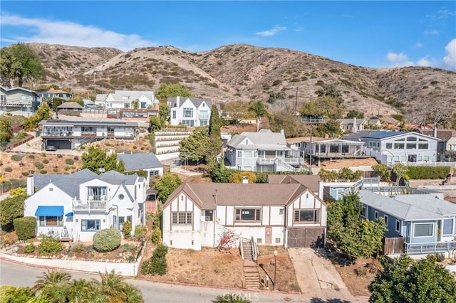 birds eye view of property with a mountain view