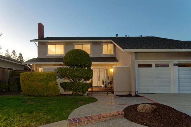 view of front of property with a lawn