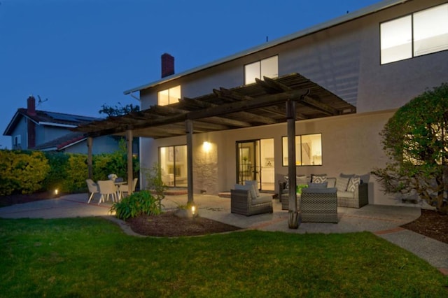 back of house featuring a pergola, an outdoor hangout area, a lawn, and a patio area