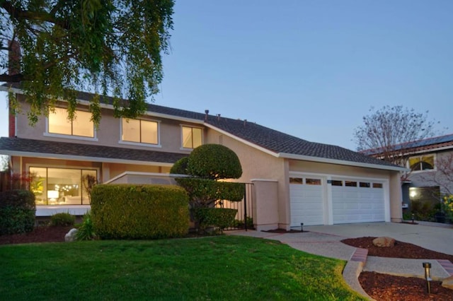 view of front of house featuring a garage and a front yard