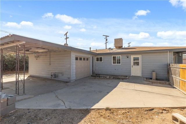 back of house featuring central AC