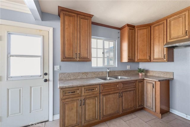 kitchen featuring sink and light tile patterned floors