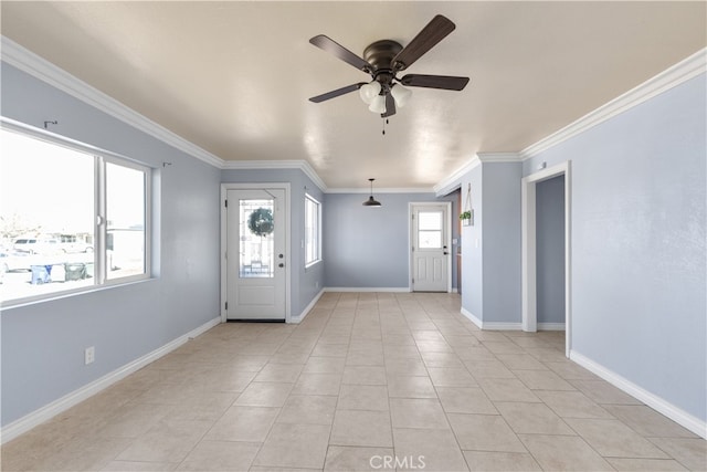 tiled entrance foyer with ornamental molding and ceiling fan