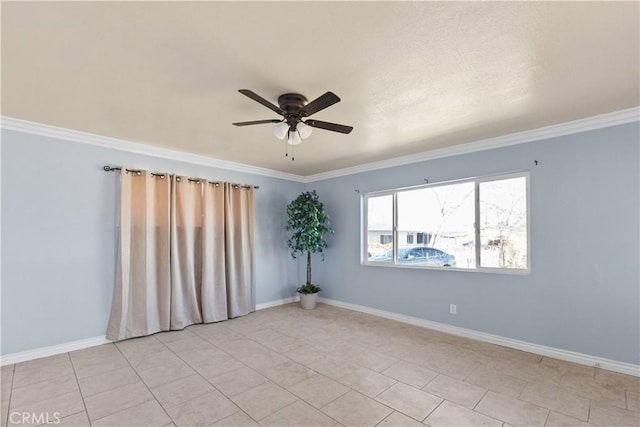 tiled empty room with ceiling fan and ornamental molding