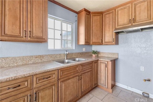 kitchen featuring sink and light tile patterned floors