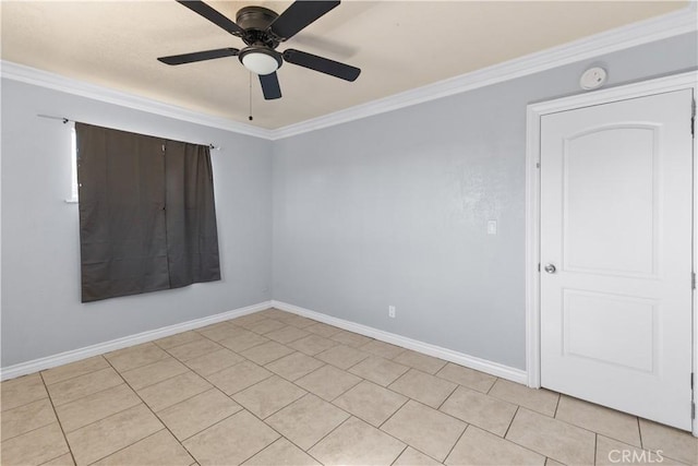 tiled spare room featuring ornamental molding and ceiling fan