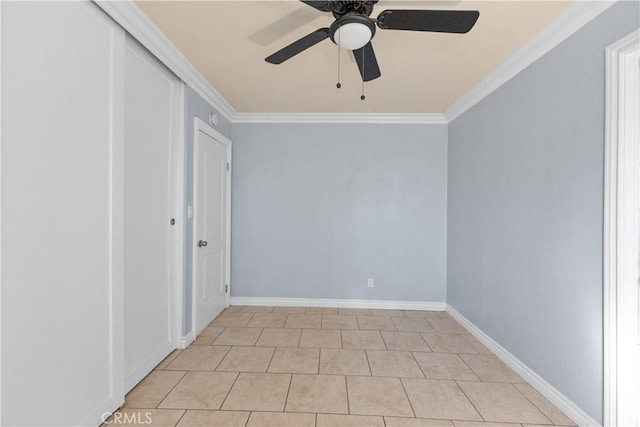 interior space with light tile patterned floors, ornamental molding, a closet, and ceiling fan