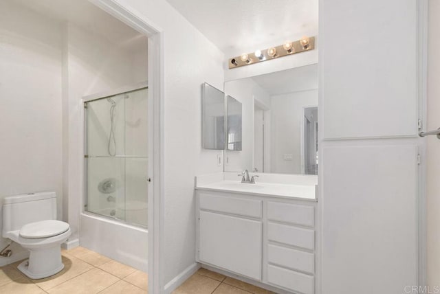 full bathroom featuring toilet, vanity, bath / shower combo with glass door, and tile patterned flooring