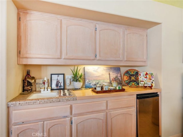 bar featuring indoor bar and refrigerator