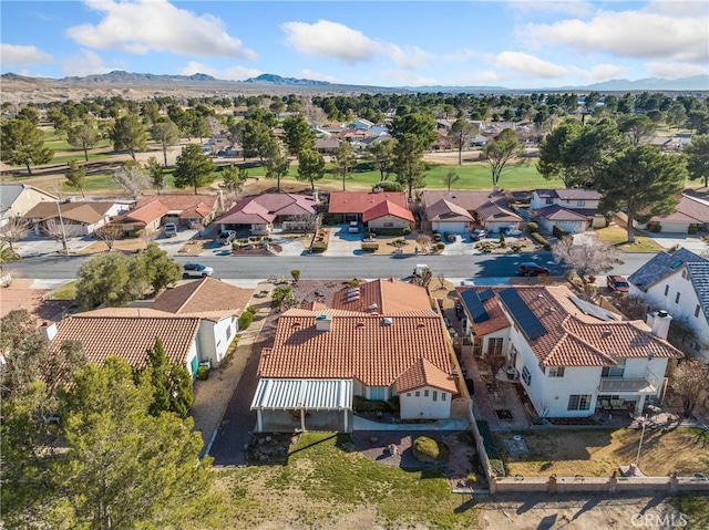 birds eye view of property featuring a mountain view and a residential view