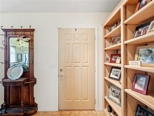 entryway with light tile patterned floors