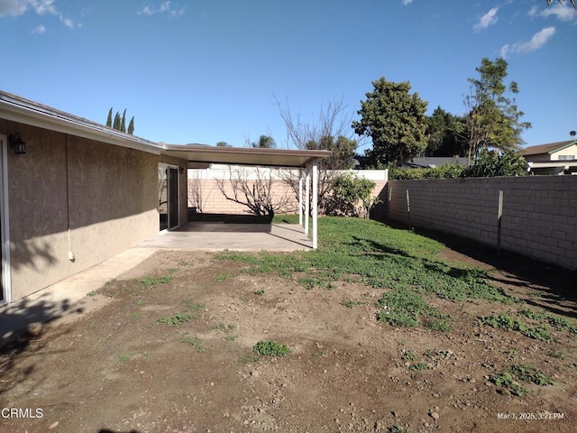 view of yard featuring a fenced backyard and a patio