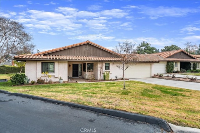 ranch-style house featuring a garage and a front yard