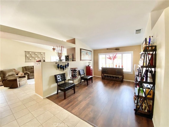 81060 Paloma Cir, Indio, CA 92201 - living area featuring vaulted ceiling, baseboards, and wood finished floors