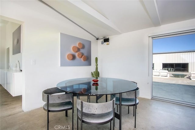 dining area with vaulted ceiling