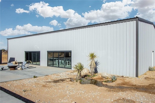 back of property with a patio area