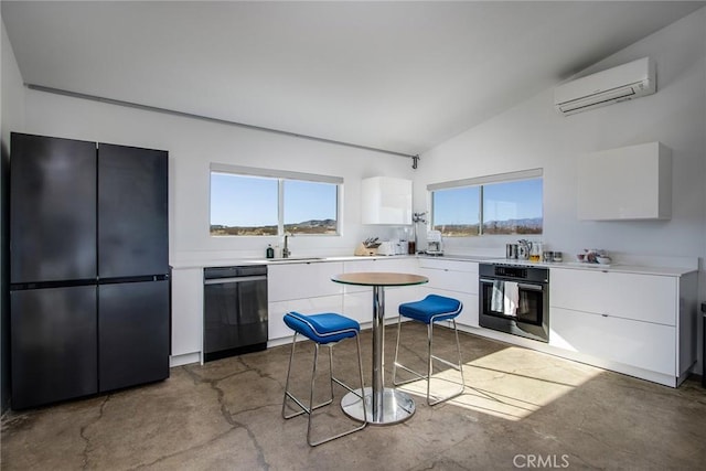 kitchen with white cabinetry, a wall mounted air conditioner, black appliances, and sink