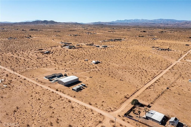 birds eye view of property featuring a mountain view