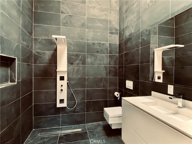 bathroom with tile walls and vanity