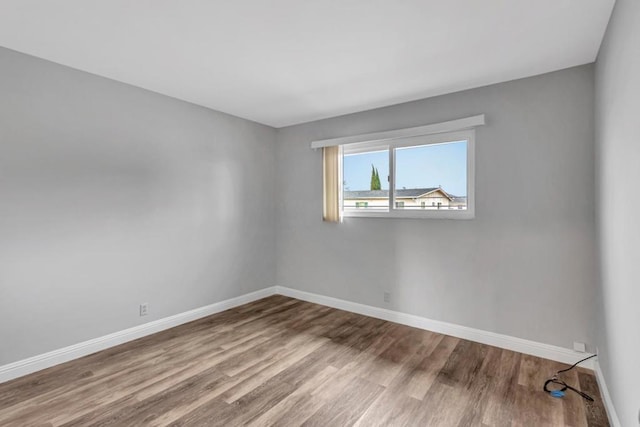 spare room featuring hardwood / wood-style floors