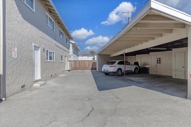 view of parking with a carport