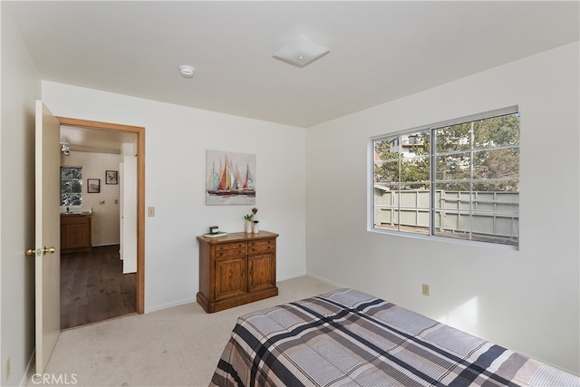 bedroom with light colored carpet