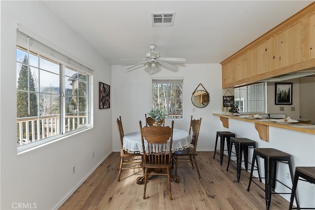 dining room featuring ceiling fan and light wood-type flooring