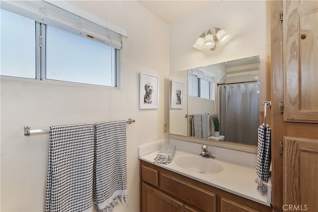 bathroom with plenty of natural light and vanity