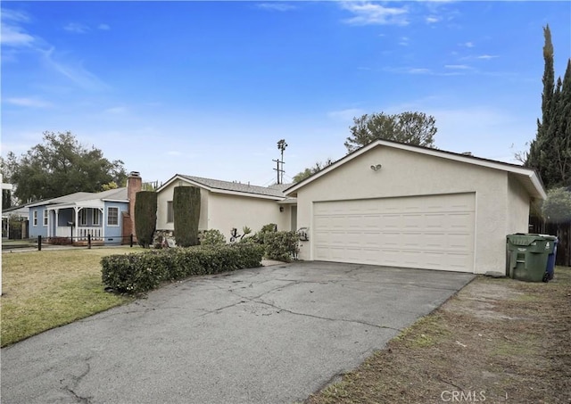 single story home featuring a garage and a front yard