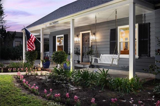 exterior entry at dusk with a porch