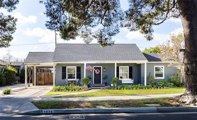 view of front of home featuring a carport