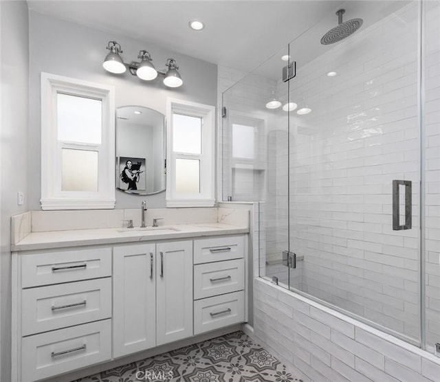 bathroom featuring vanity, an enclosed shower, and tile patterned floors